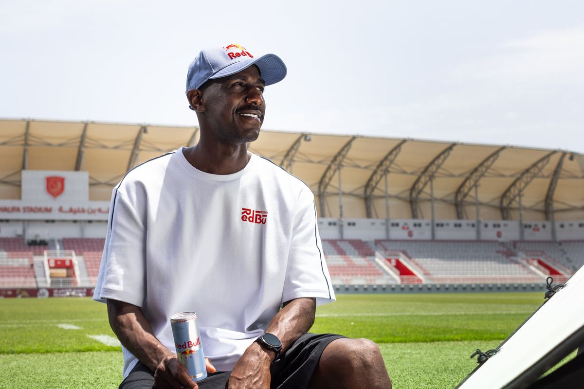 Almoez Ali at a stadium in a Red Bull cap