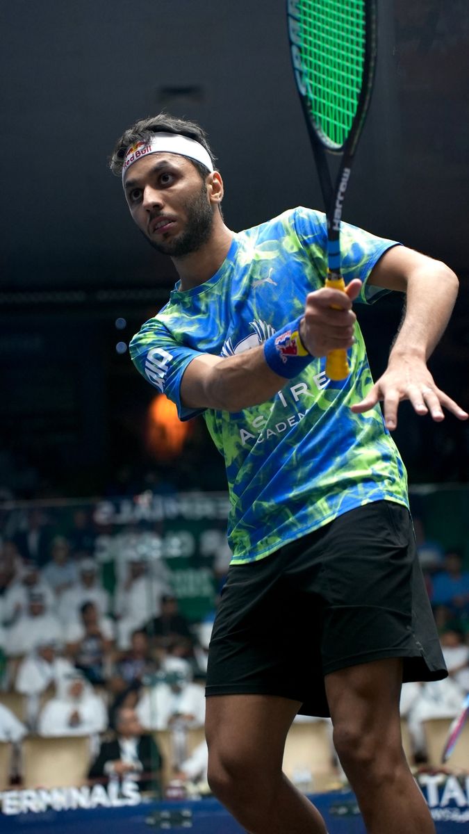 Abdullah Tamimi mid-swing in an Aspire Academy jersey