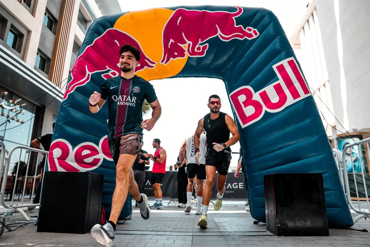 Competitors running through the start arch at Savage Line 2026