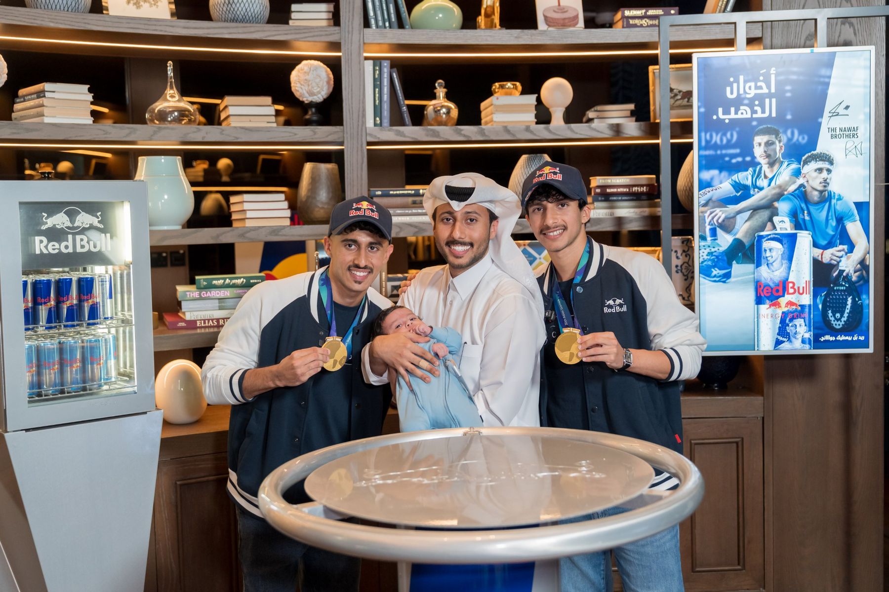 The brothers holding their gold medals at a Red Bull celebration