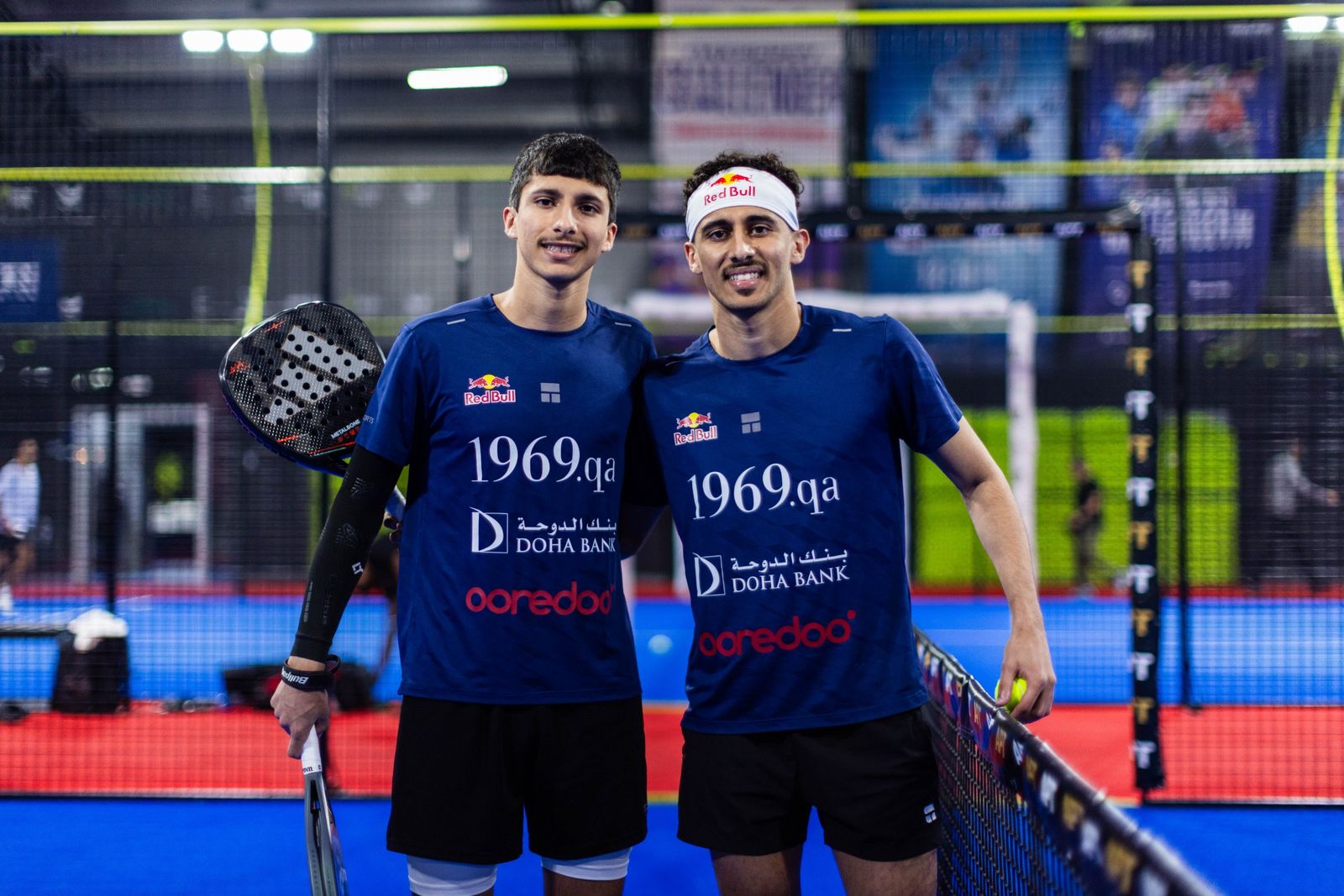 The brothers posing together at the net