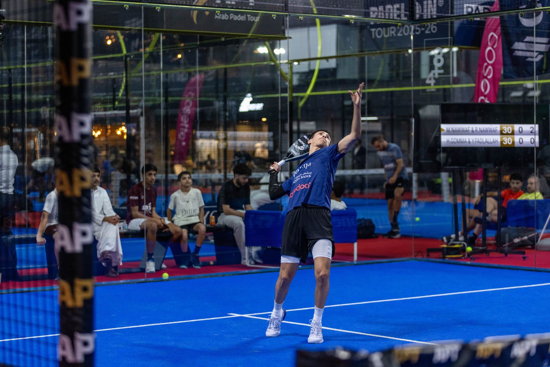 Mashari serving at the Arab Padel Tour